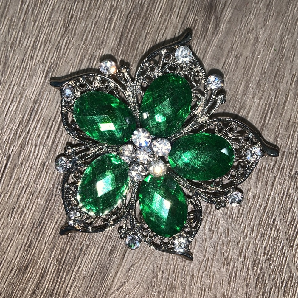 Green and silver broach